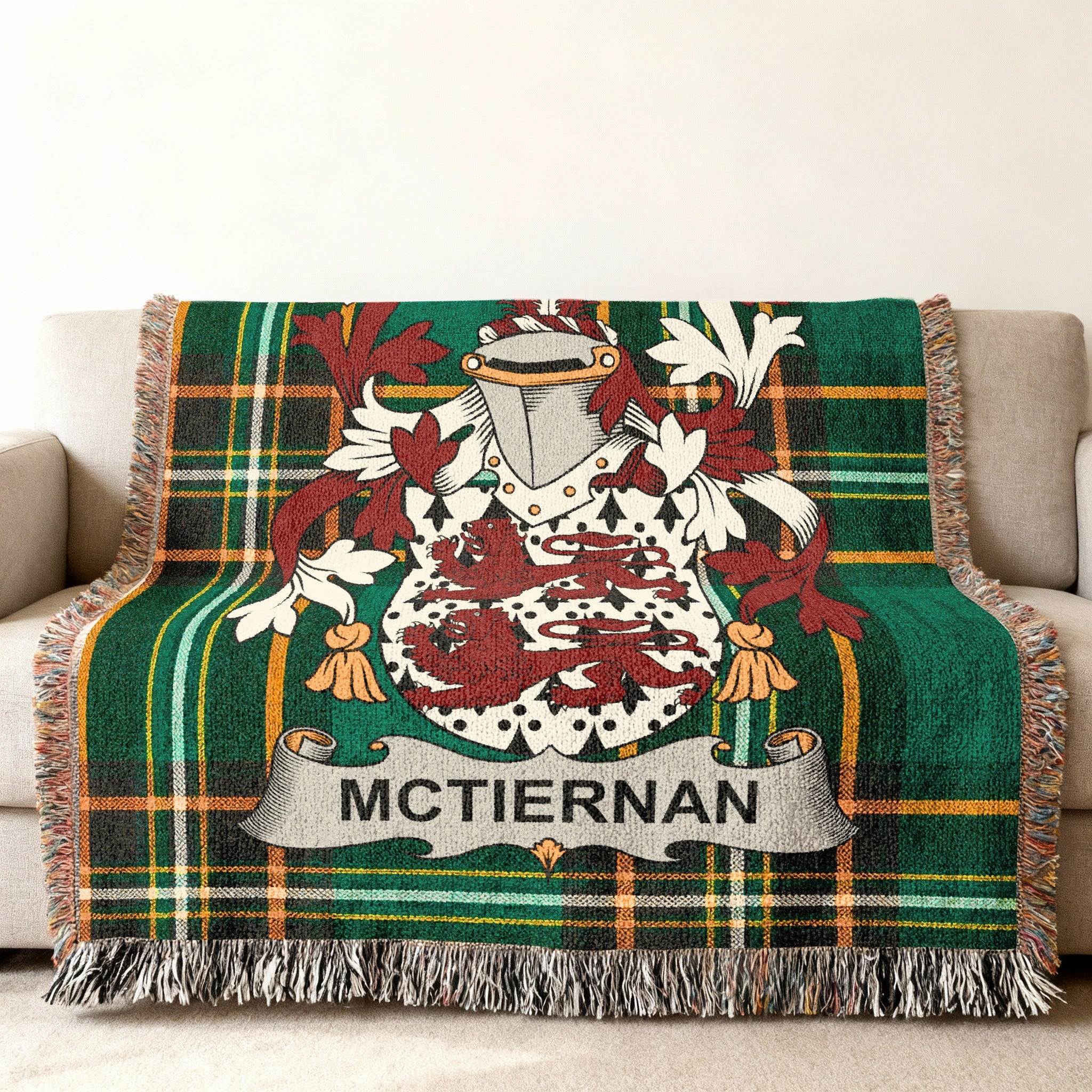 McTiernan family crest on a green plaid woven throw blanket.