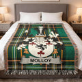 Molloy family crest on green plaid woven throw blanket.