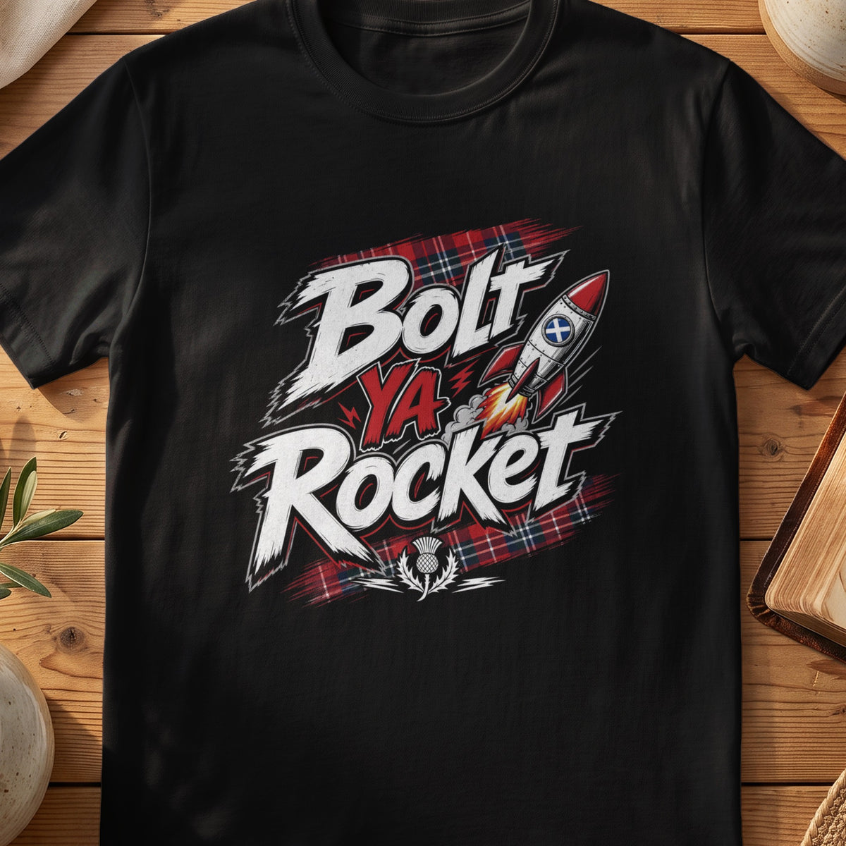 Black Gildan 64000 unisex T-shirt flatlay with Bolt Ya Rocket Scottish graphic design