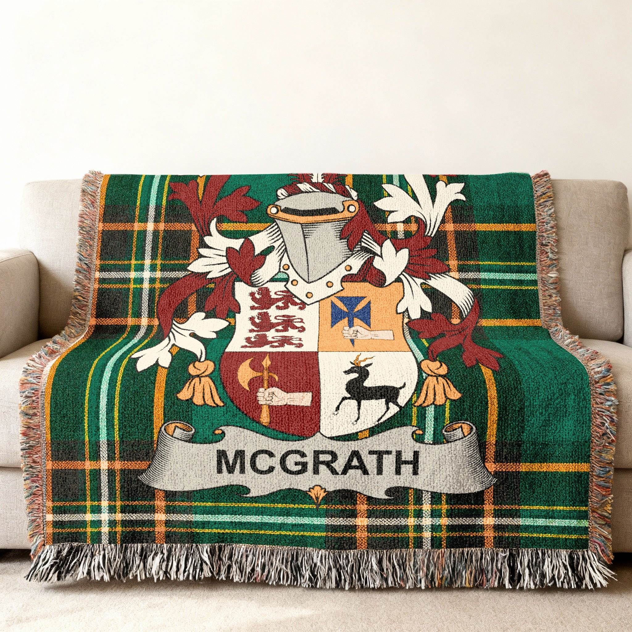 McGrath family crest on a green tartan throw blanket.