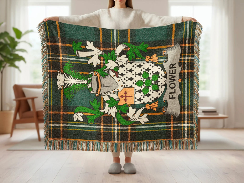 Tartan blanket with family crest and "FLOWER" text.