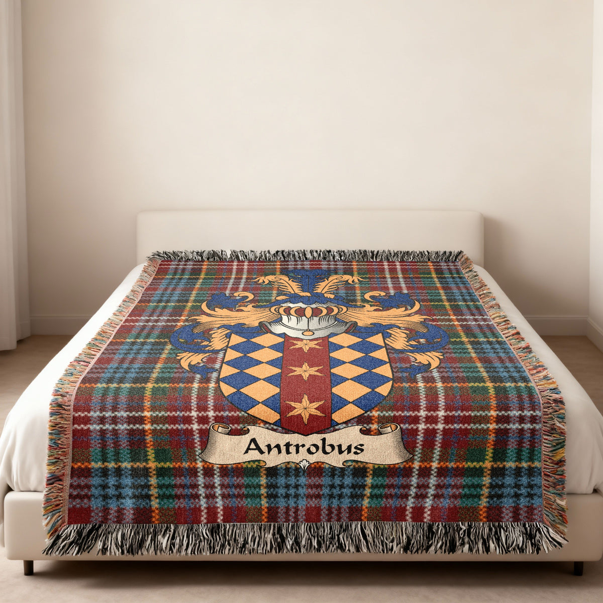 Antrobus family crest emblem on a Caledonia tartan woven blanket