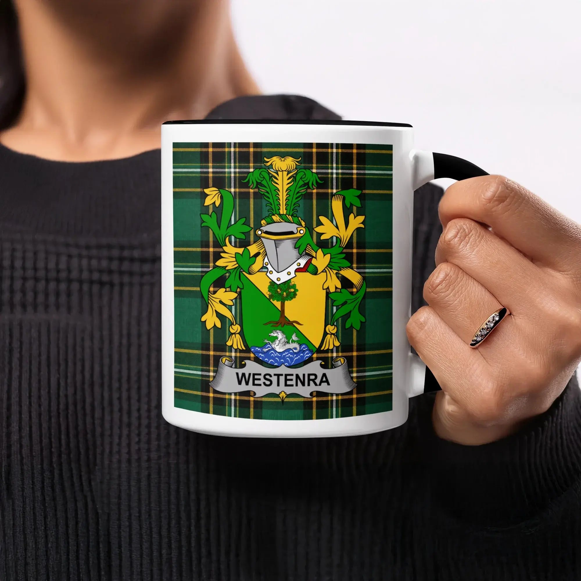 Mug with green, yellow, and blue plaid and a coat of arms labeled WESTENRA.