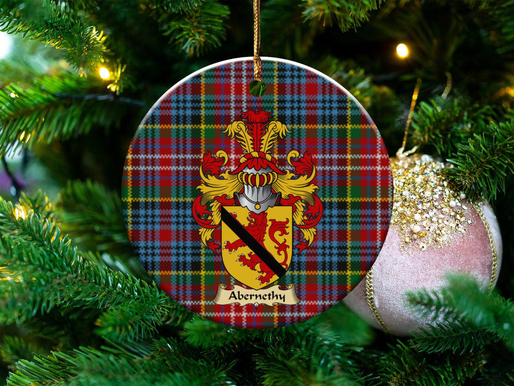 Abernethy Scottish clan ceramic ornament with family crest on a Caledonia tartan background, hanging on a Christmas tree