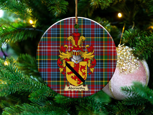 Abernethy Scottish clan ceramic ornament with family crest on a Caledonia tartan background, hanging on a Christmas tree