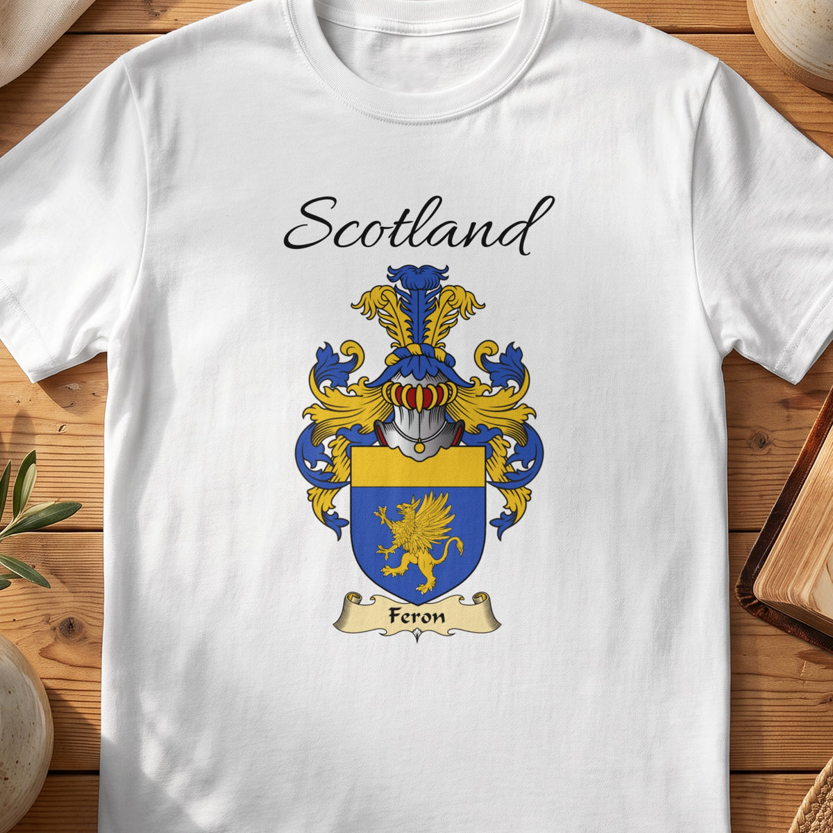 White Feron Scottish family shield T-shirt featuring a gold winged creature on blue