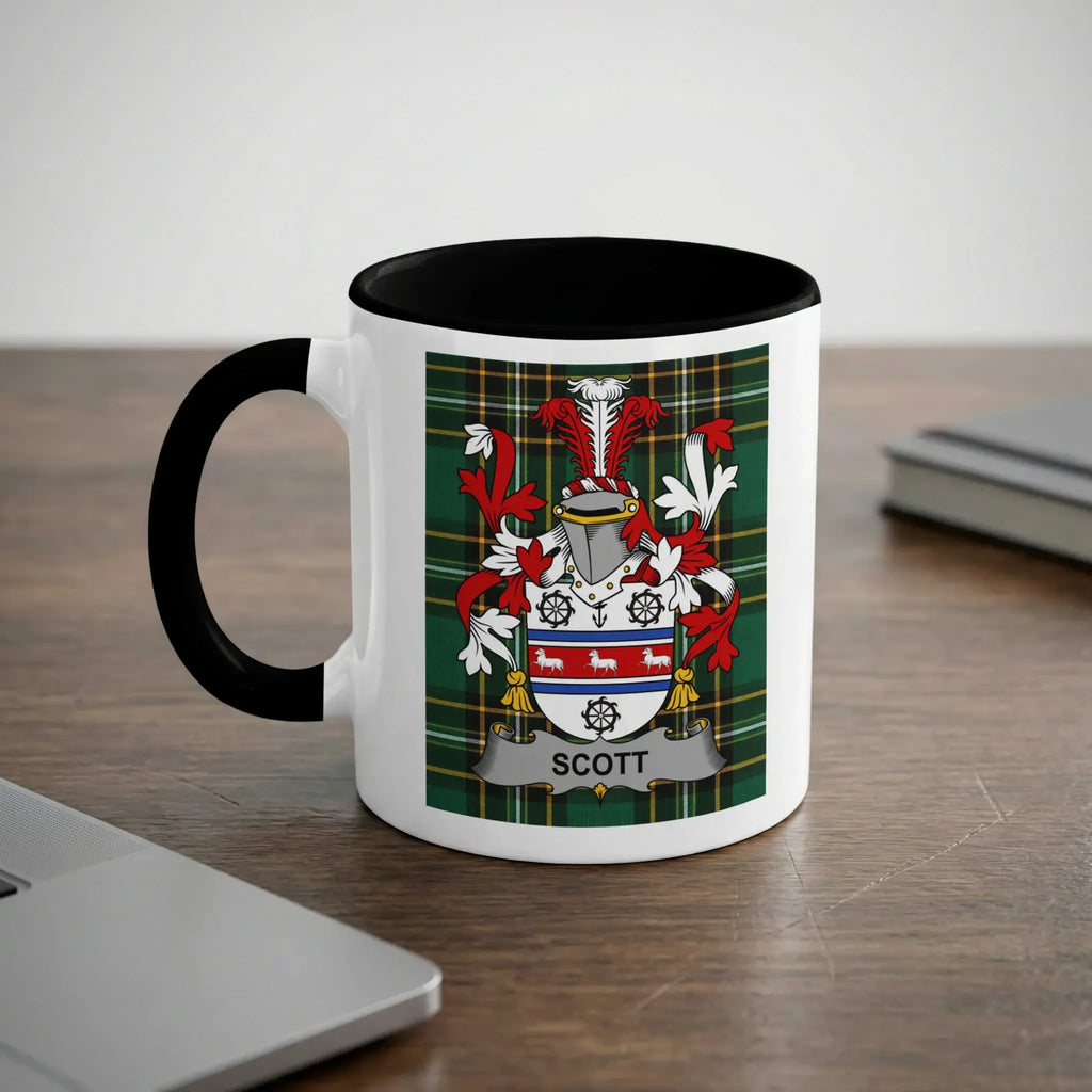 White mug with black rim featuring the Scott family crest and tartan pattern.