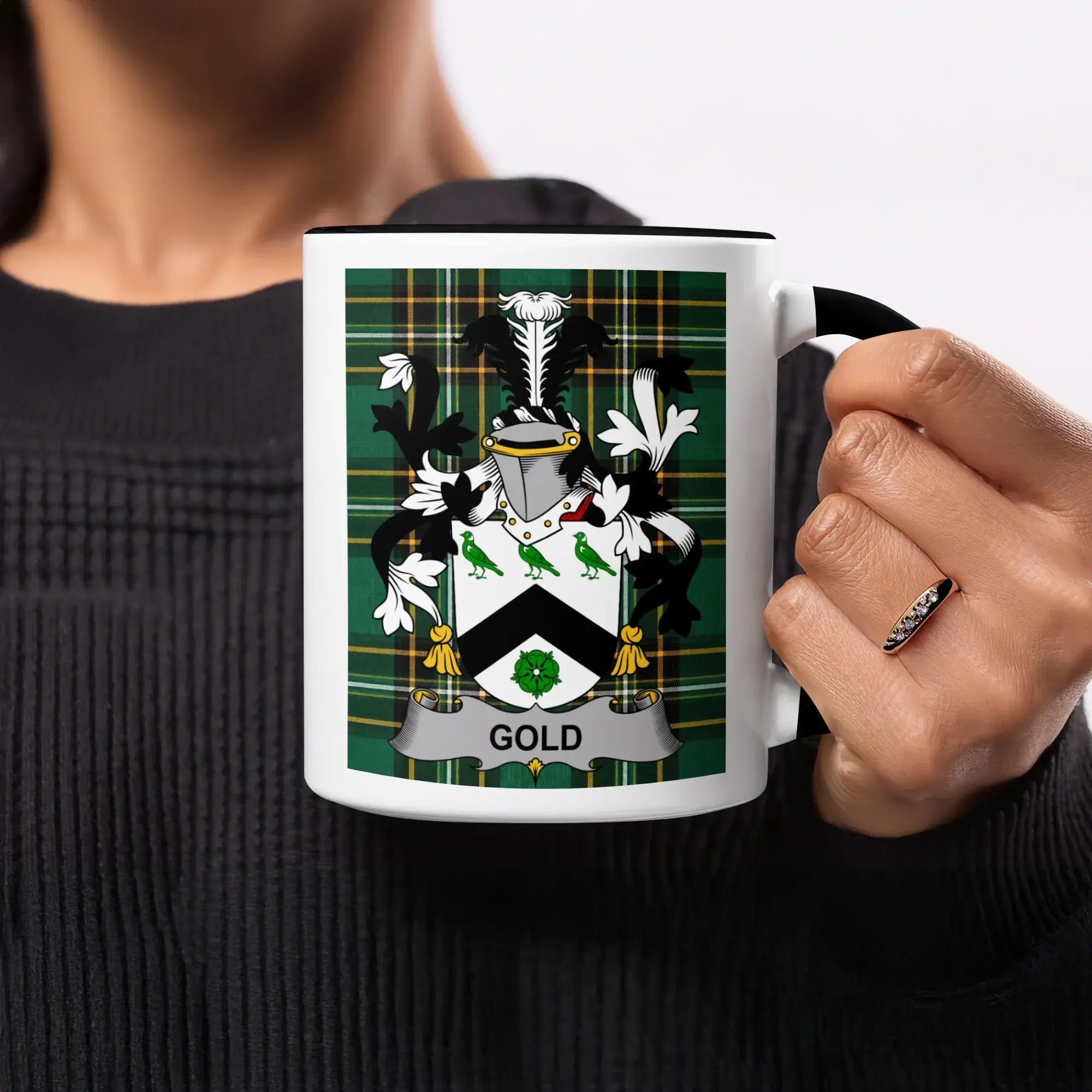 Mug with Gold family crest on tartan background.