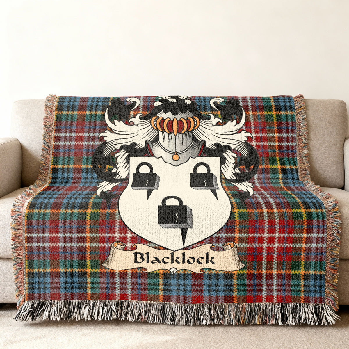 Blacklock Scottish family shield woven blanket on a Caledonia tartan background