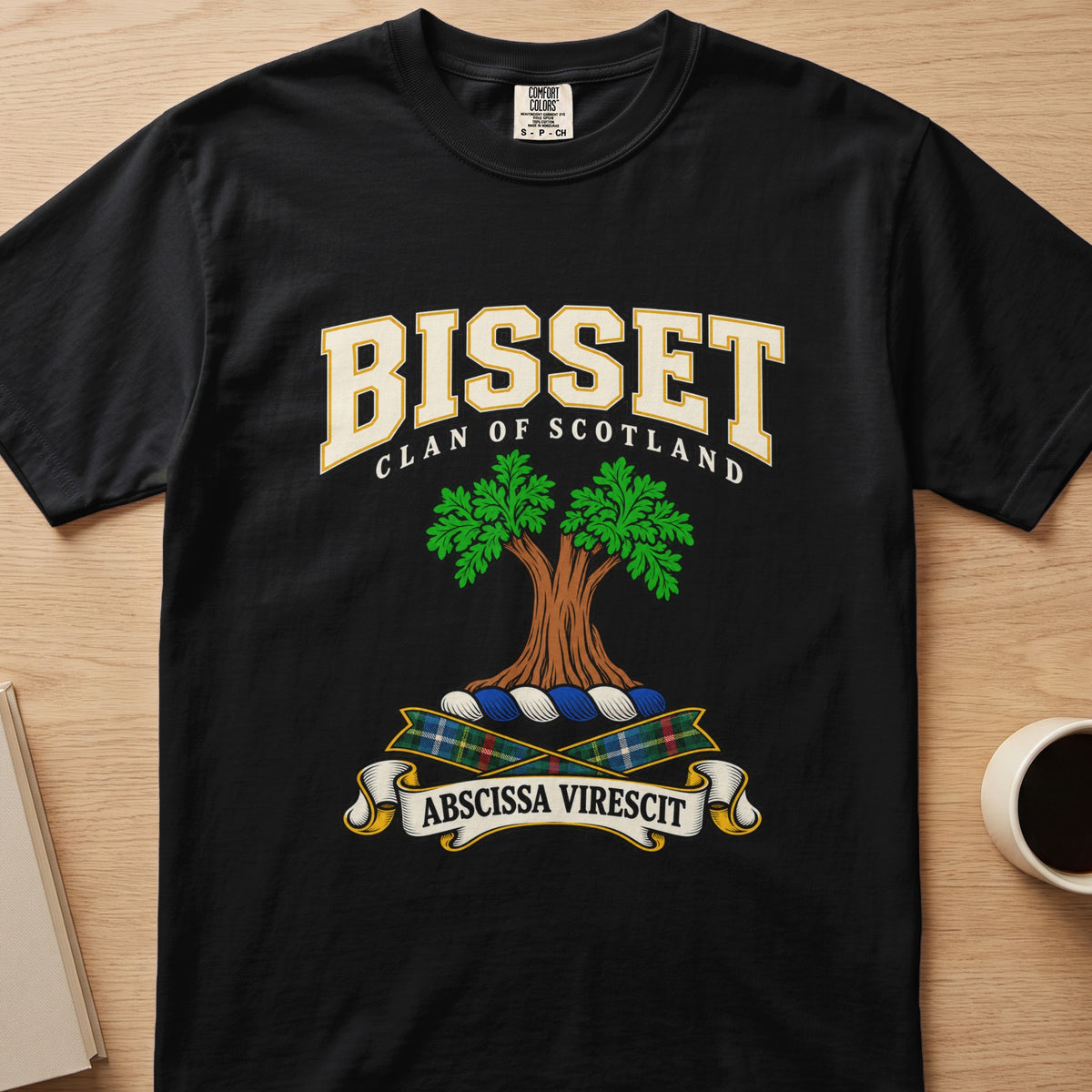 Bisset double-canopied green tree crest graphic on a black Comfort Colors T-shirt, front view