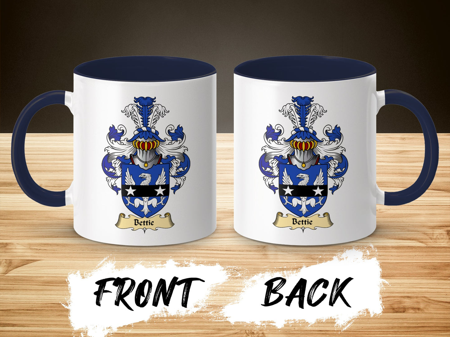 Two views of a white ceramic mug with a blue handle, featuring a coat of arms with the name "Bettie".