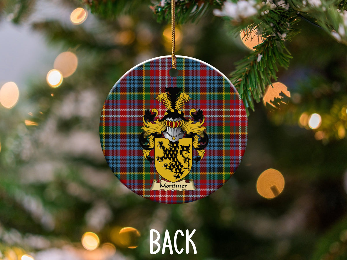 Mortimer ceramic ornament detail showing a double-sided family shield on a Caledonia tartan background