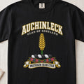 Auchinleck Scottish clan T-shirt in Black, front view with a golden ear of wheat and motto banner.