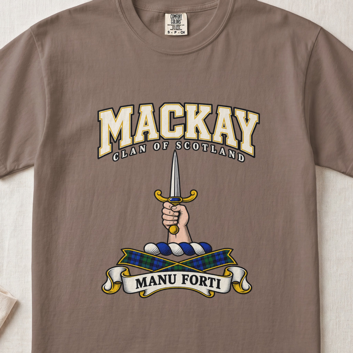 MacKay graphic T-shirt in Espresso brown, front flat lay showing varsity lettering and hand and forearm holding an upright silver dagger with gold hilt.