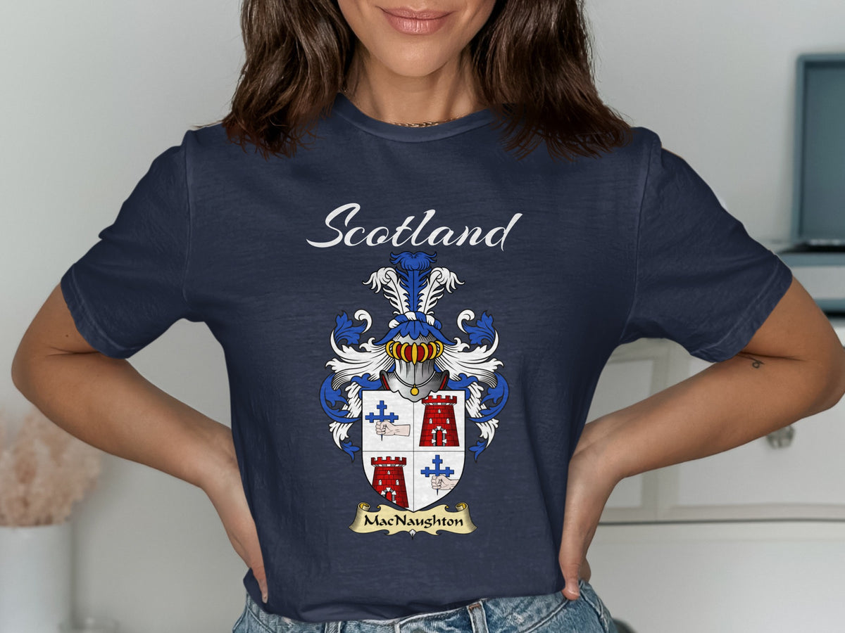 Model wearing a navy MacNaughton T-shirt featuring a quartered shield with red towers and blue crosses