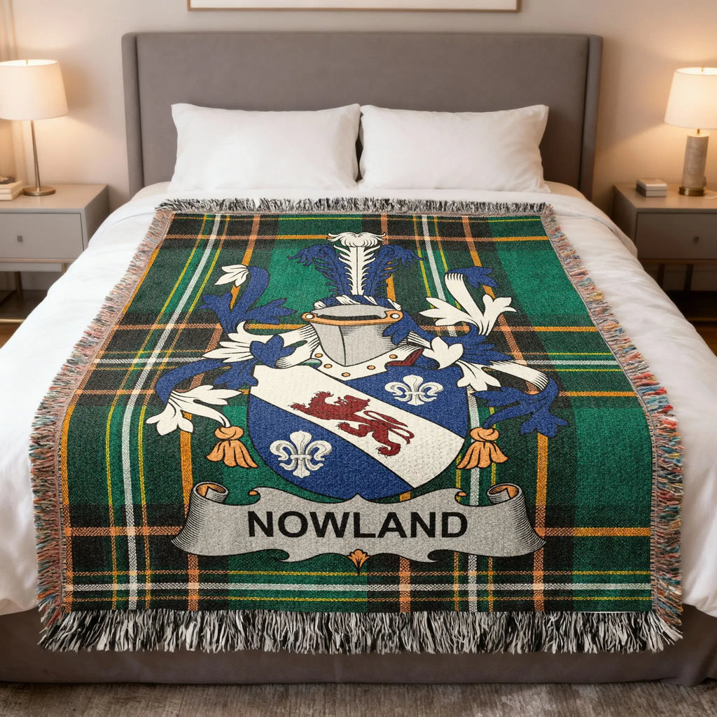 Green tartan blanket with the "Nowland" coat of arms centered.