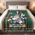 Green tartan blanket with the "Nowland" coat of arms centered.