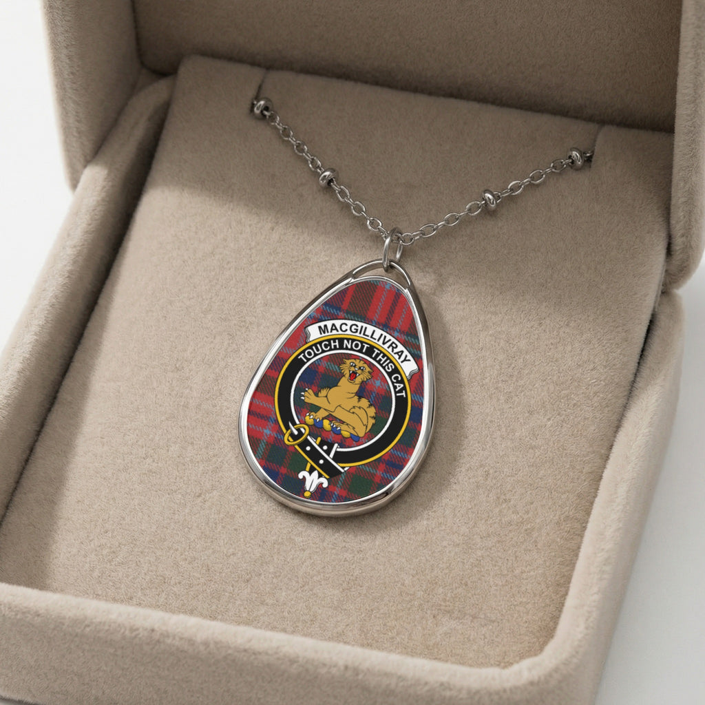 Oval pendant with tartan and MacGILLIVRAY family crest of a cat.