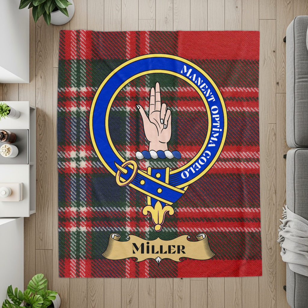 Miller crest with Manent Optima Coelo motto on tartan throw — detail
