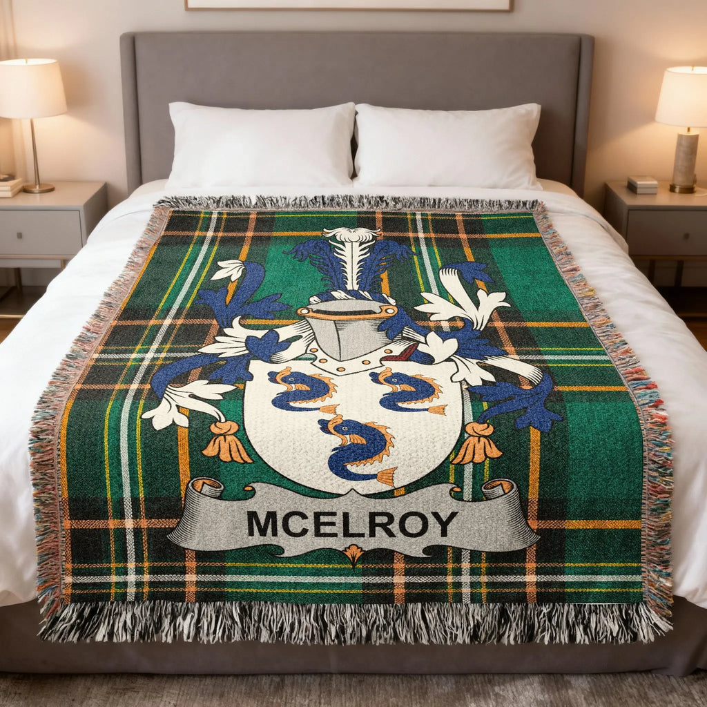 McElroy family crest displayed on a green and blue plaid woven throw blanket.