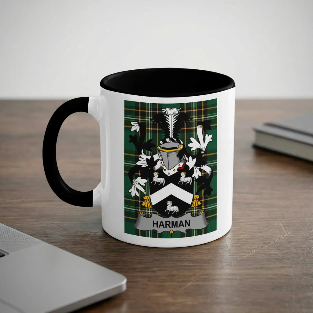 White mug with black handle, featuring a coat of arms with "HARMAN" banner.