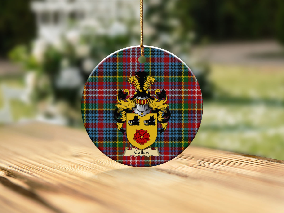 Round Cullen Scottish clan ornament with family crest on a Caledonia tartan background