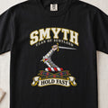 Smyth Scottish clan T-shirt in Black, front view with an armoured arm holding a dagger and motto design.