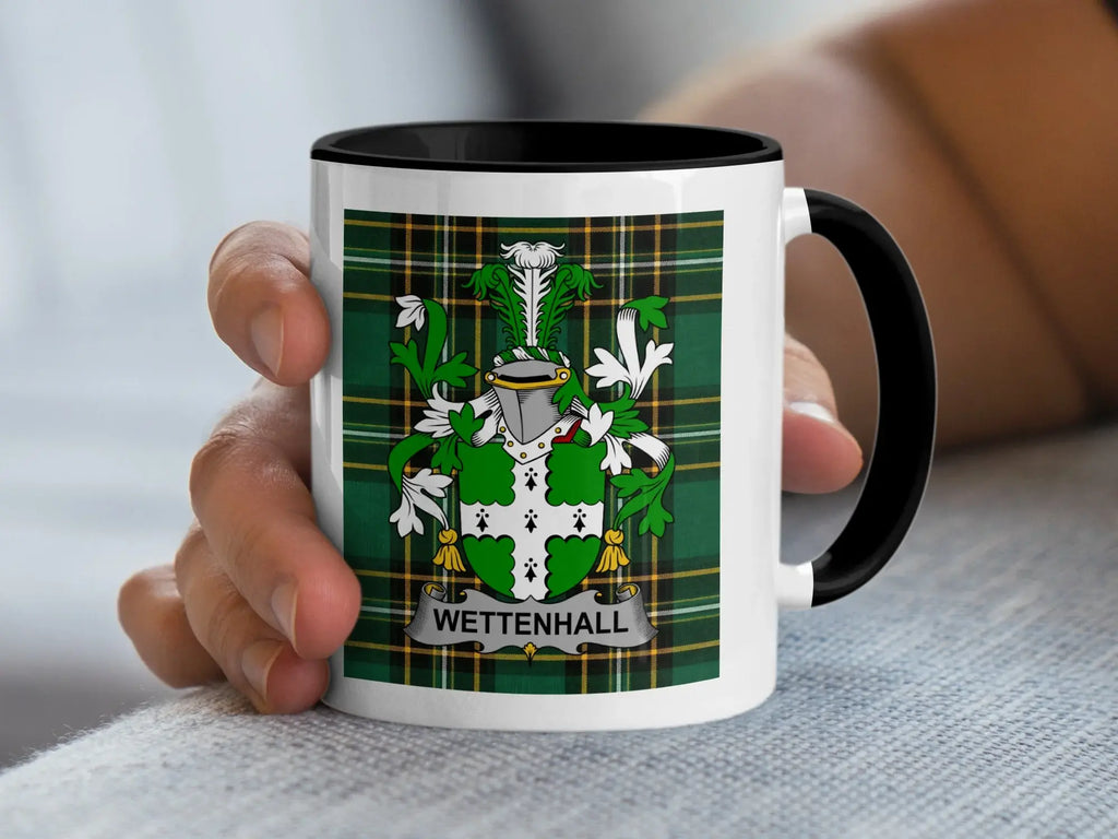 White mug with a tartan pattern and a coat of arms with the name "Wettenhall".