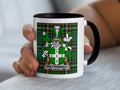 White mug with a tartan pattern and a coat of arms with the name "Wettenhall".