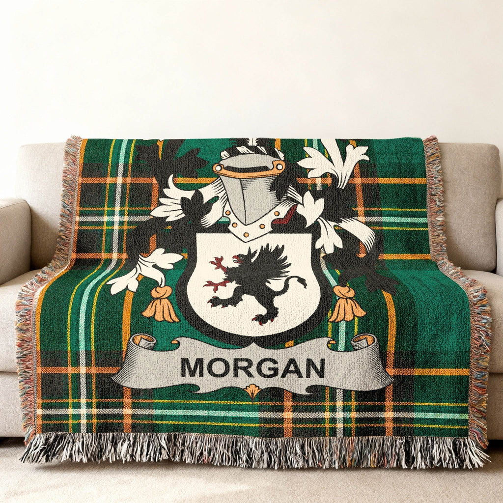 Morgan family crest on a green plaid throw blanket.
