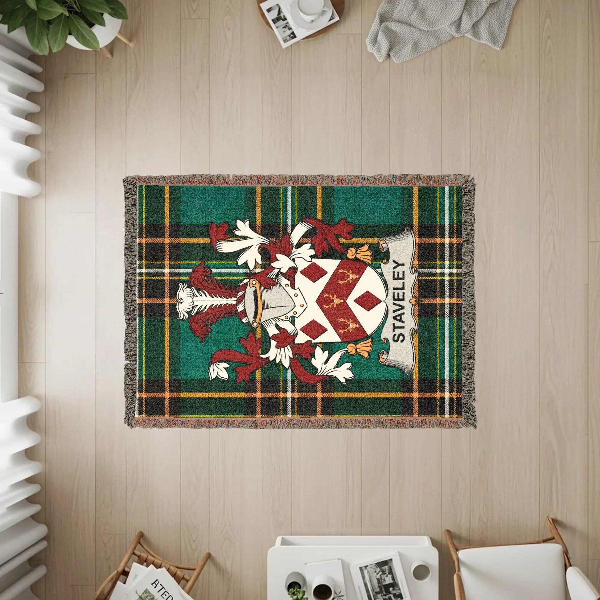 Staveley tartan throw blanket with coat of arms, woven texture.