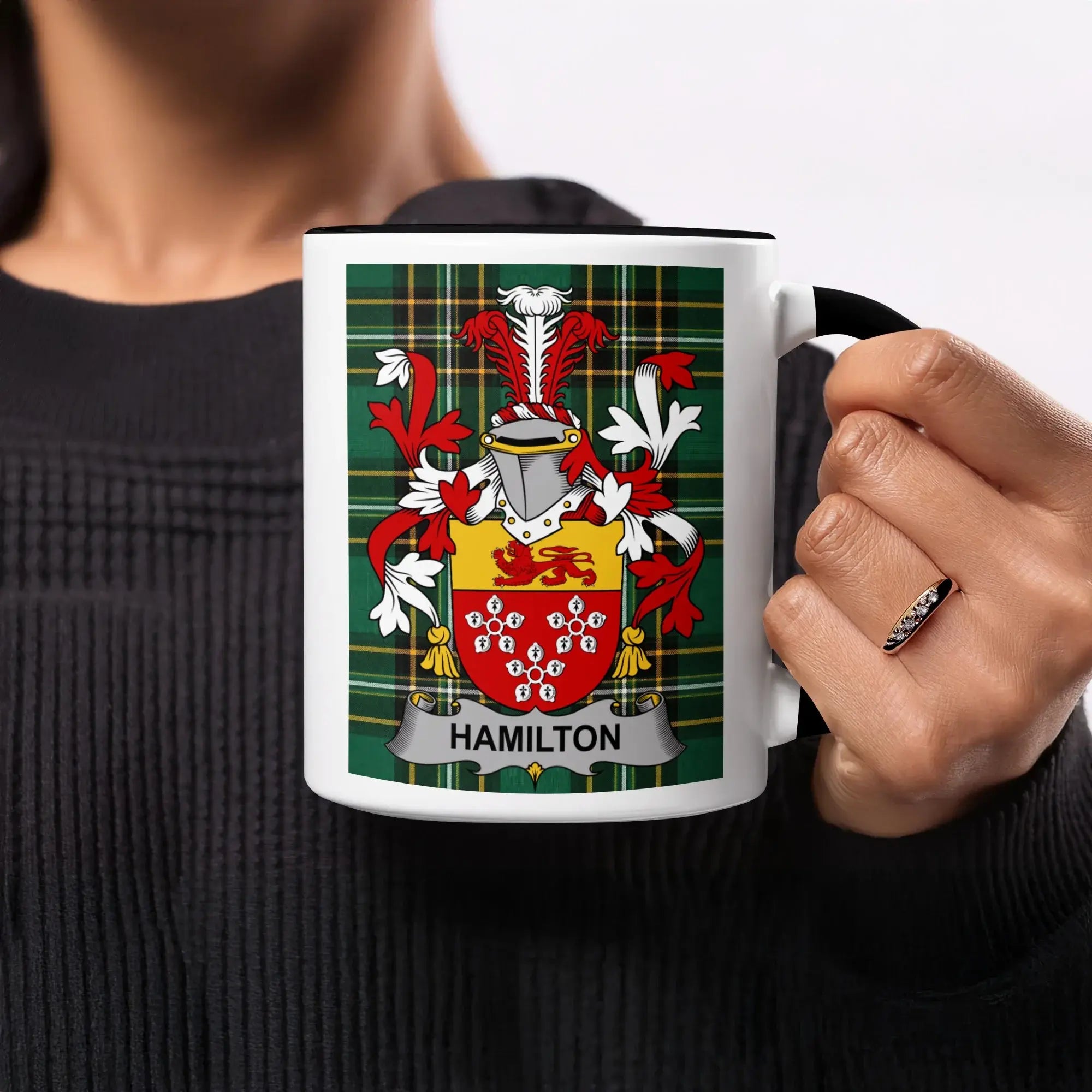 Mug with Hamilton family crest on green plaid background.