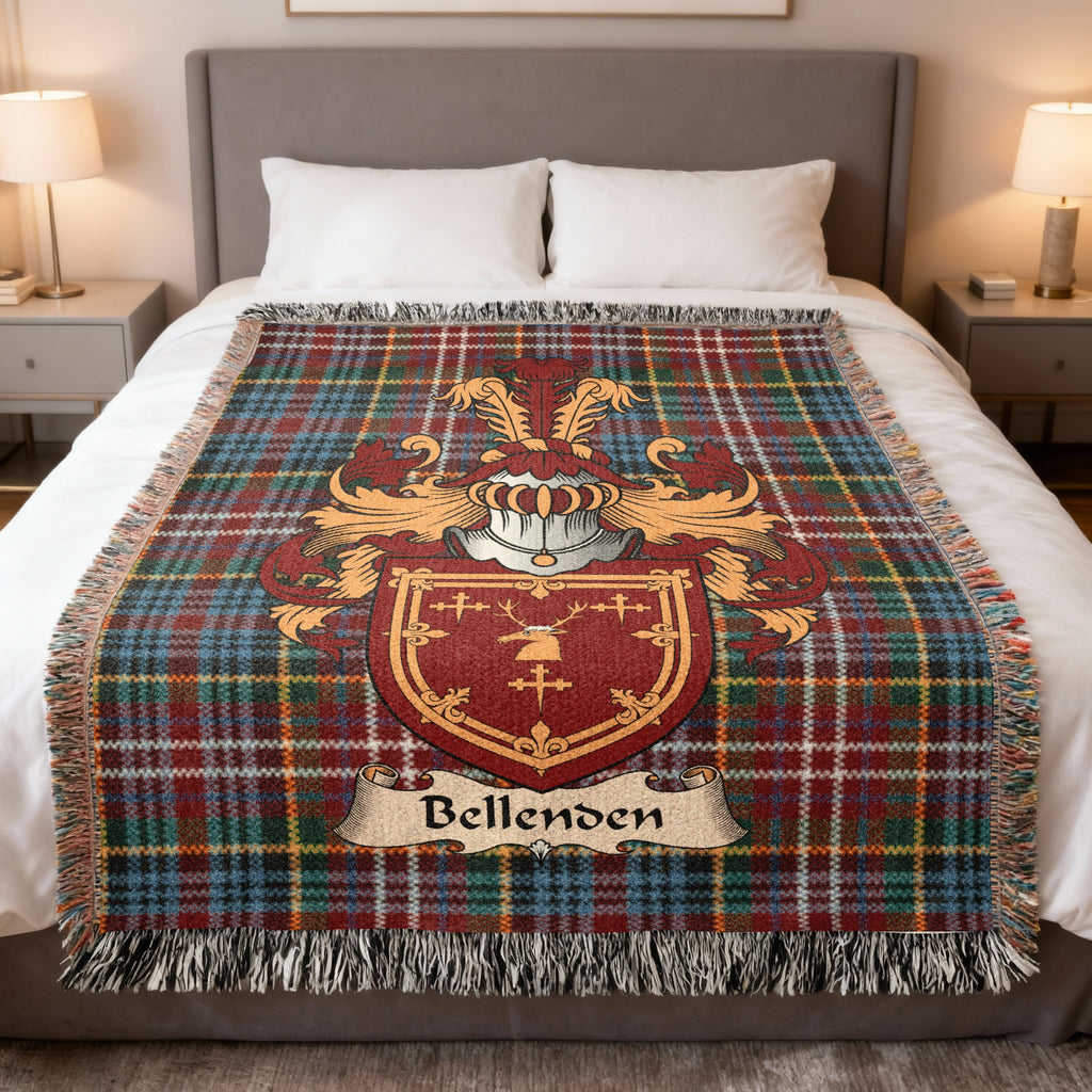 Bellenden Scottish family crest woven blanket on a Caledonia tartan background, displayed on a bed