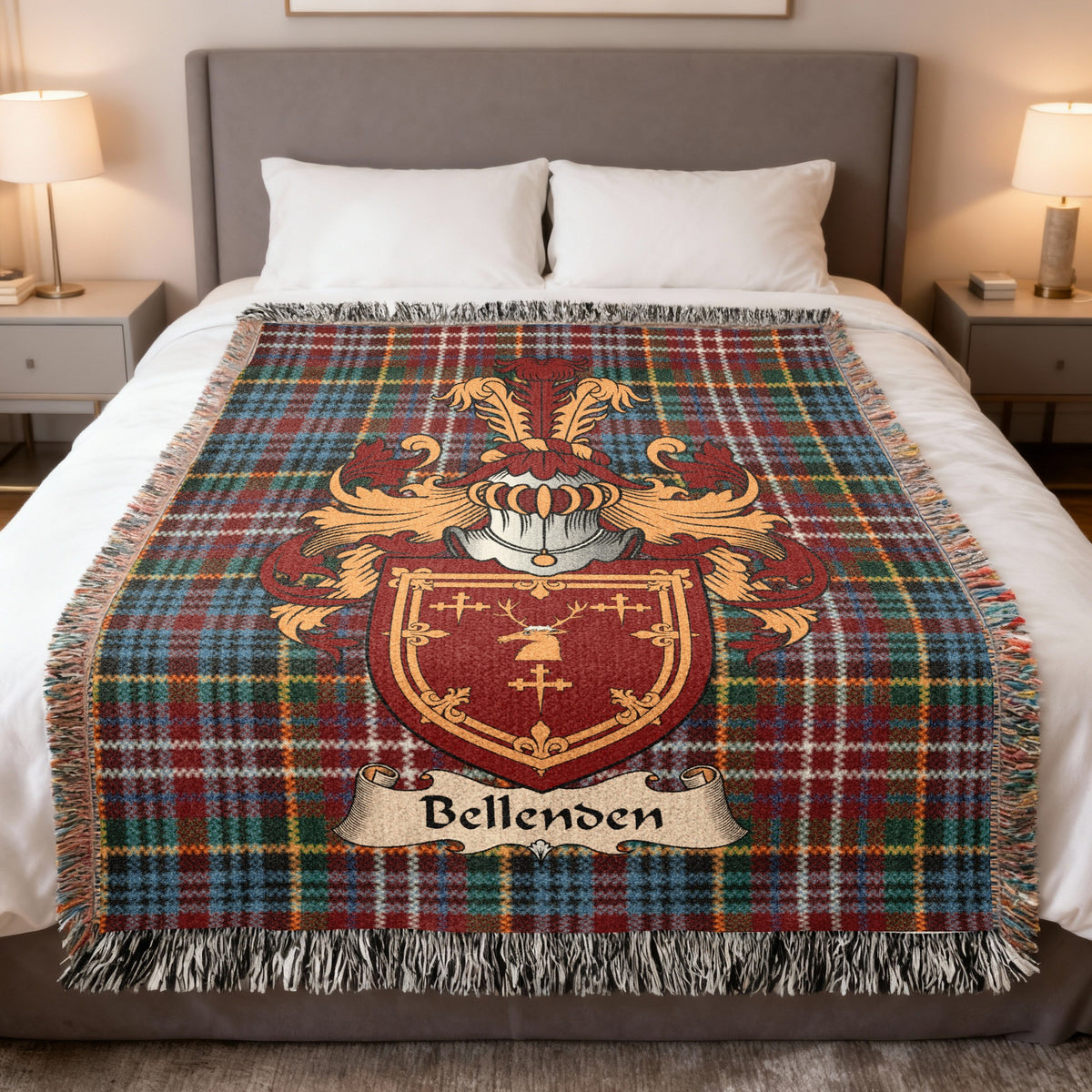 Bellenden Scottish family crest woven blanket on a Caledonia tartan background, displayed on a bed