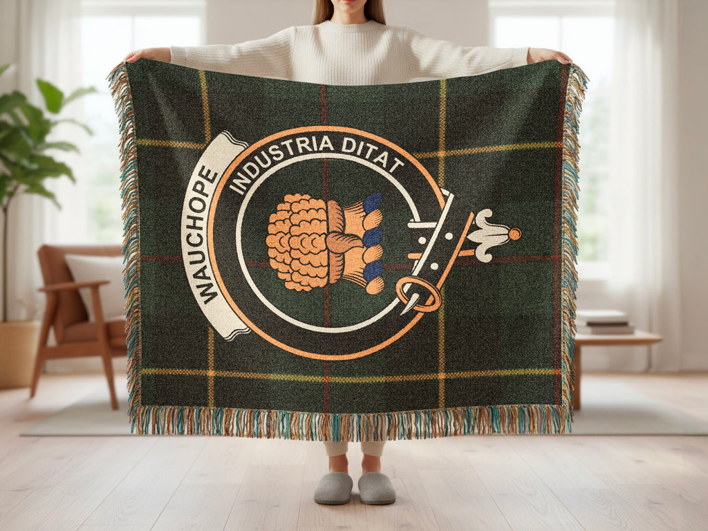 Person holding the Wauchope woven blanket to show the full design, tartan background and fringe