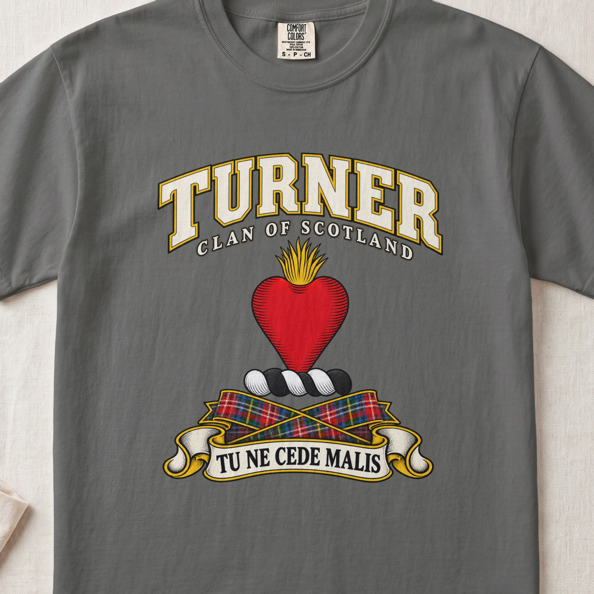 Turner Scottish clan T-shirt in Pepper, front view with a red heart topped with golden flames and motto banner.
