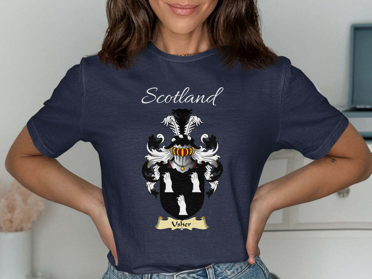 Model wearing the navy Usher family crest T-shirt featuring “Scotland” and the surname banner.