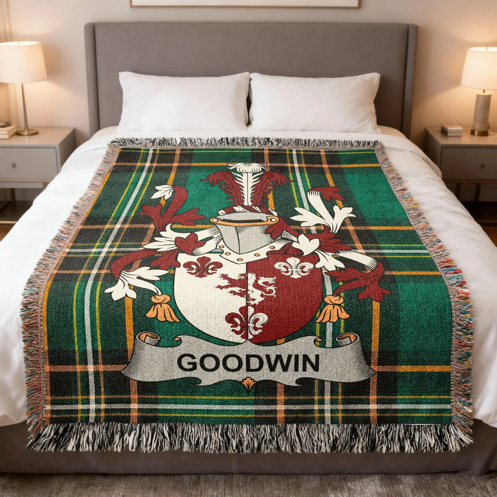 Plaid throw blanket with a coat of arms and the name GOODWIN.