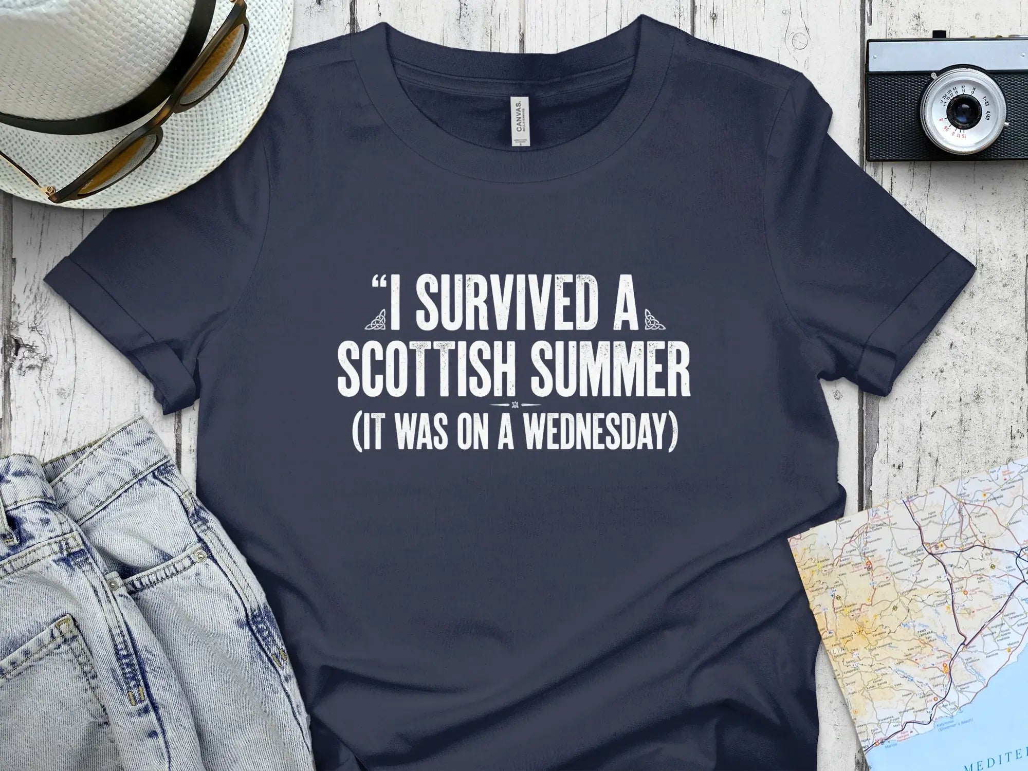 Navy t-shirt with white text "I survived a Scottish summer (it was on a Wednesday)".