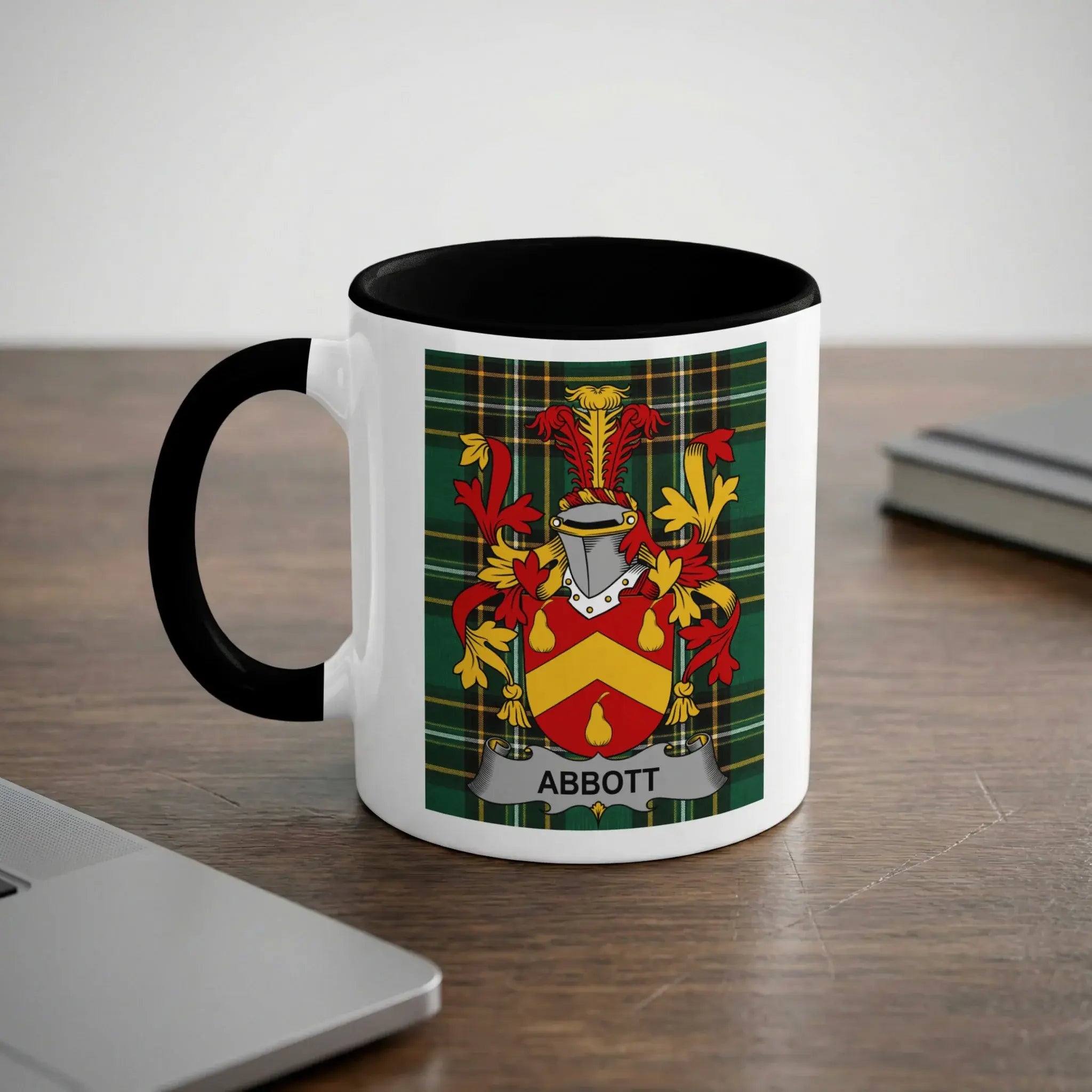 White mug with black rim, featuring the Abbott family crest.