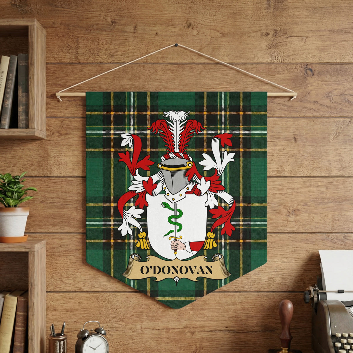 O'DONOVAN banner with coat of arms on green tartan background.