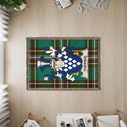 Green tartan blanket with Topping family crest and name.