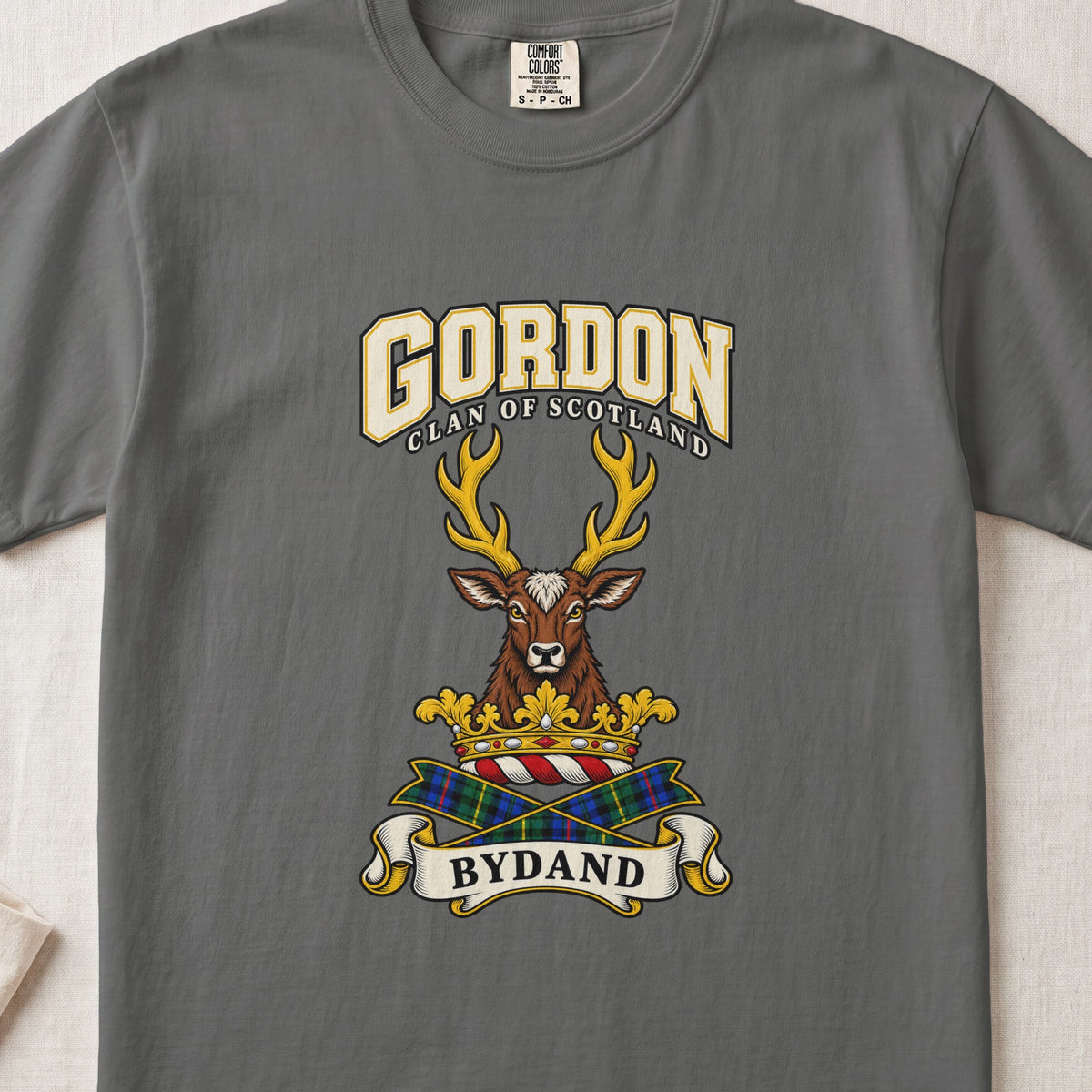 Gordon graphic T-shirt in Pepper gray, front flat lay showing varsity lettering and forward-facing brown stag head with gold antlers.