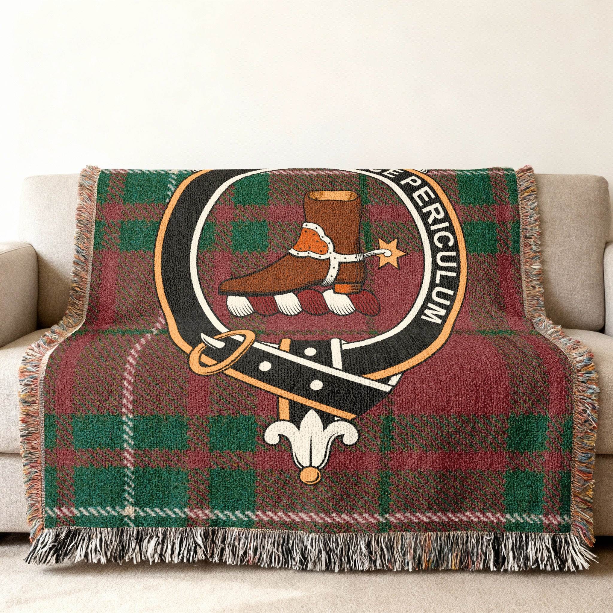Clan MacAulay tartan woven blanket — fringe border detail showing woven pattern and clan crest