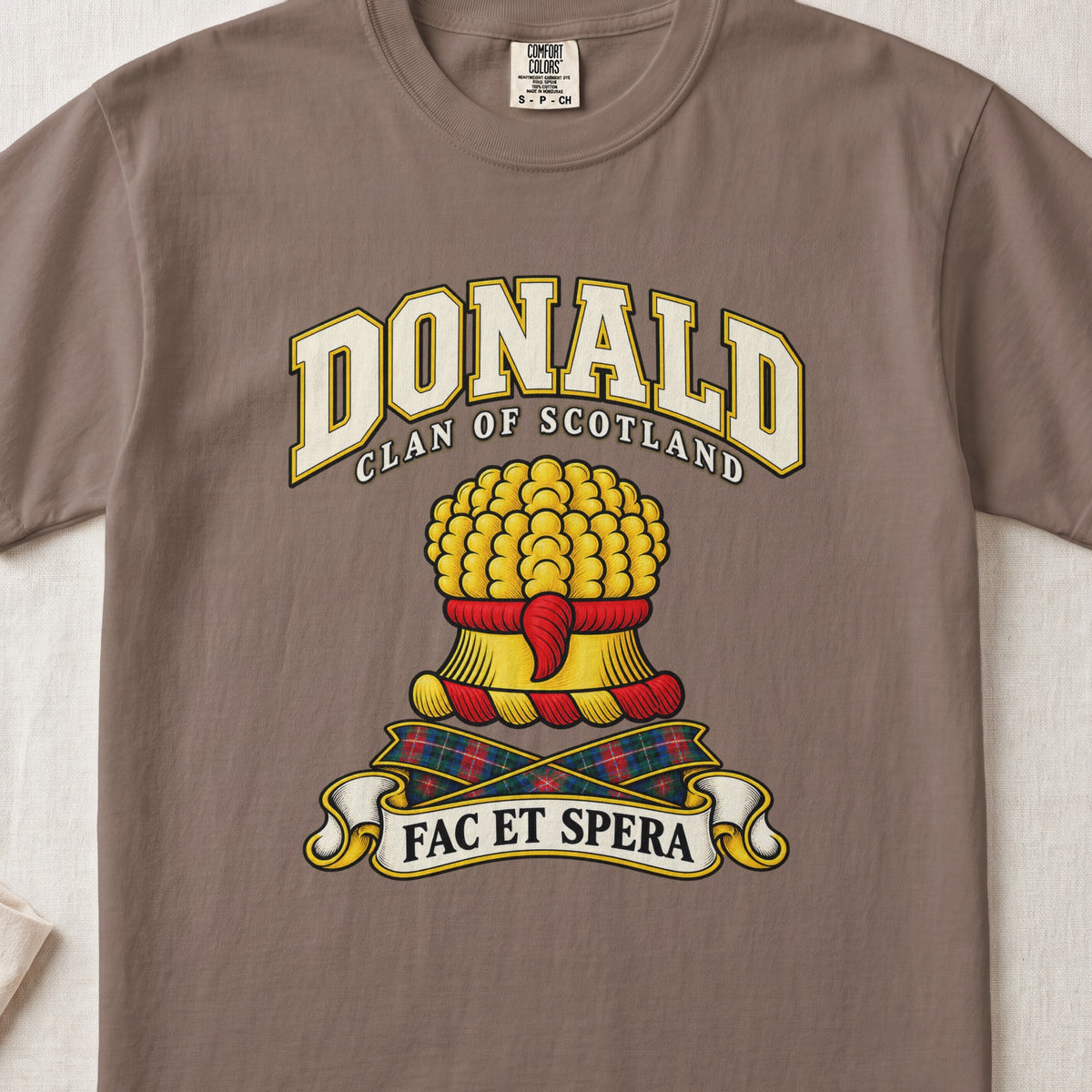 Donald Scottish clan T-shirt in Espresso, front view with a gold sheaf of wheat and motto banner.