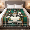 Green plaid blanket with a crest and "MISSET" banner.