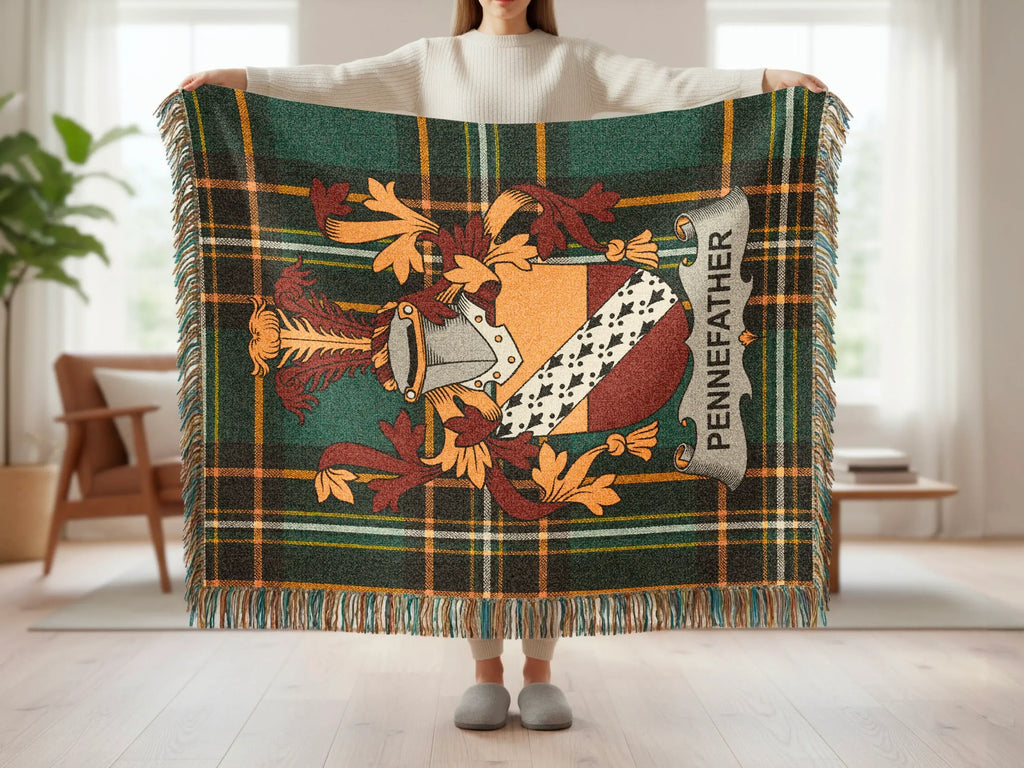 Tartan throw blanket with a coat of arms featuring PENNEFATHER.