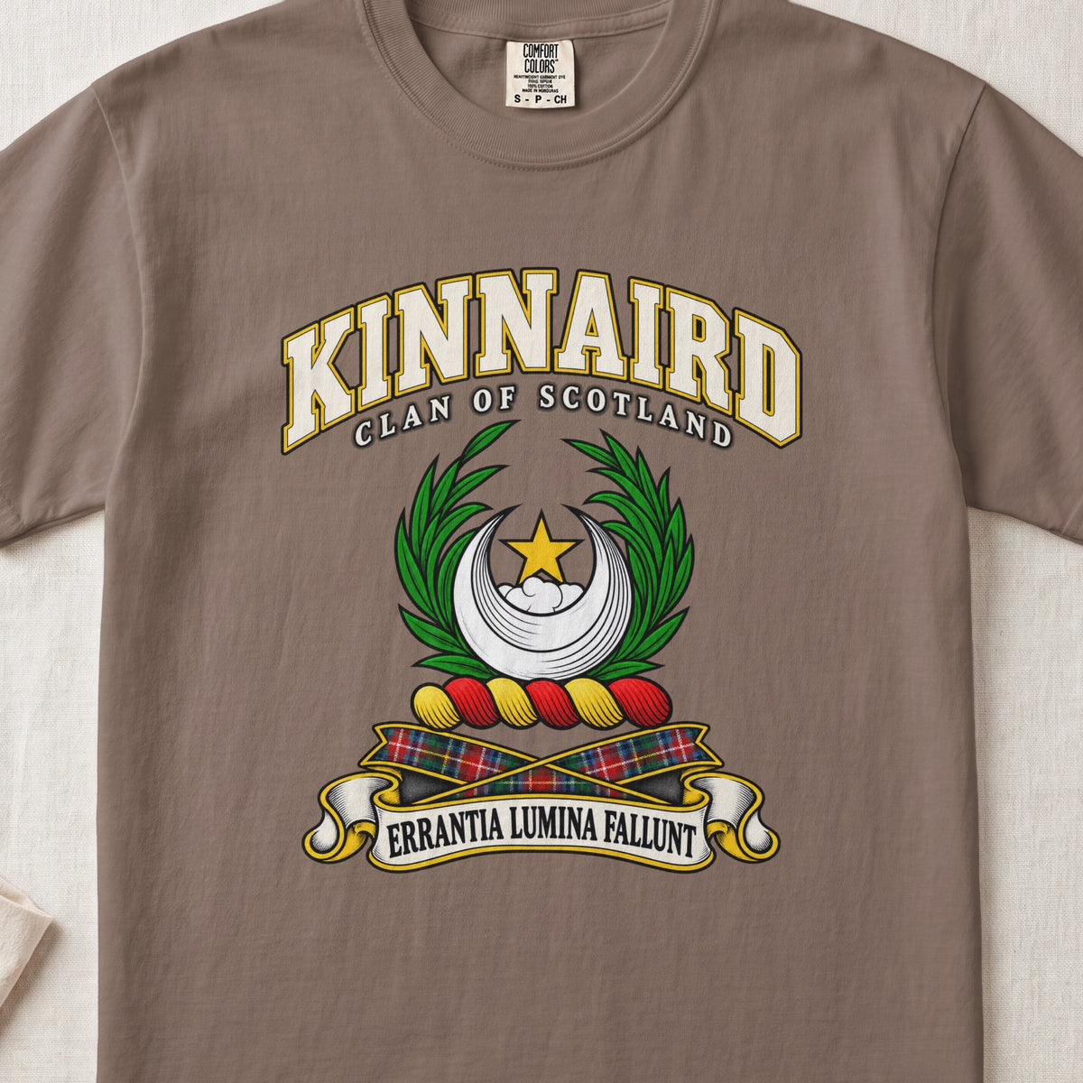 Kinnaird Scottish clan T-shirt in Espresso, front view with a silver crescent, gold star and green leafy branches and motto design.