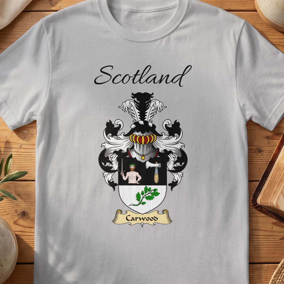 Sport Grey Carwood Scottish family shield T-shirt featuring a human figure and axe above green leaves