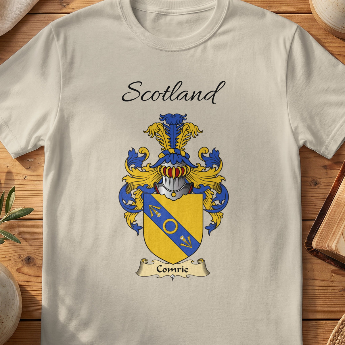 Sand Comrie Scottish family shield T-shirt featuring a blue diagonal band with gold detailing
